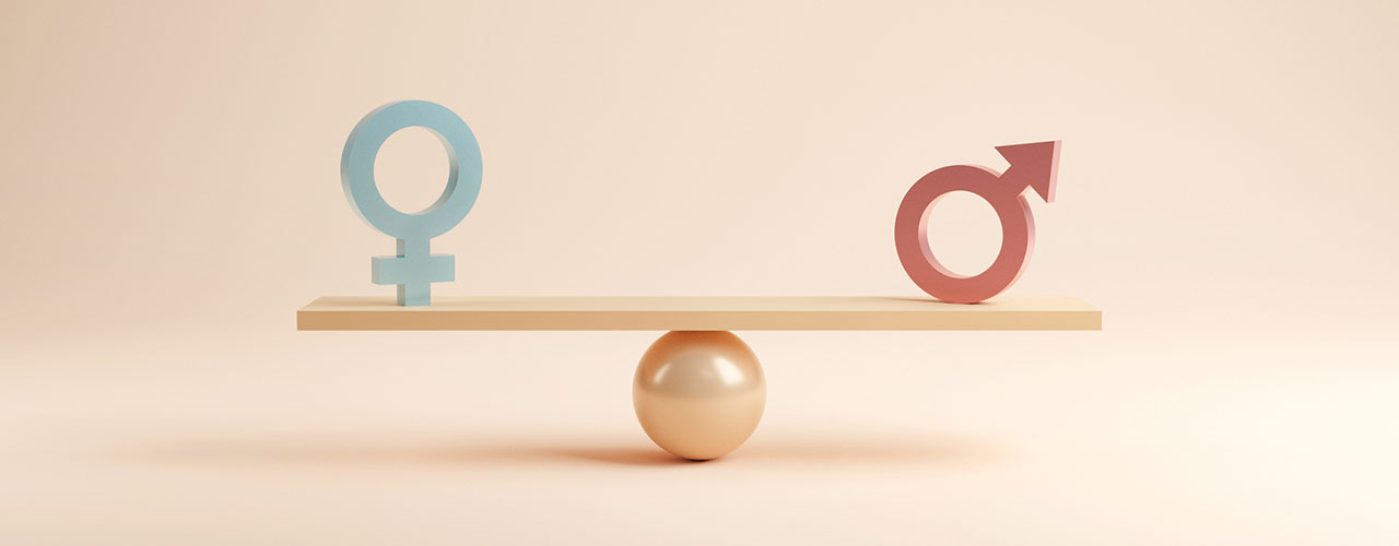 Male and female symbols on scales